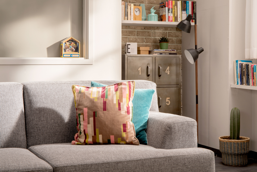 A Living Room With a Couch and Pillows and a Lamp - Chicago, IL - Martinez Chicago Junk Removal