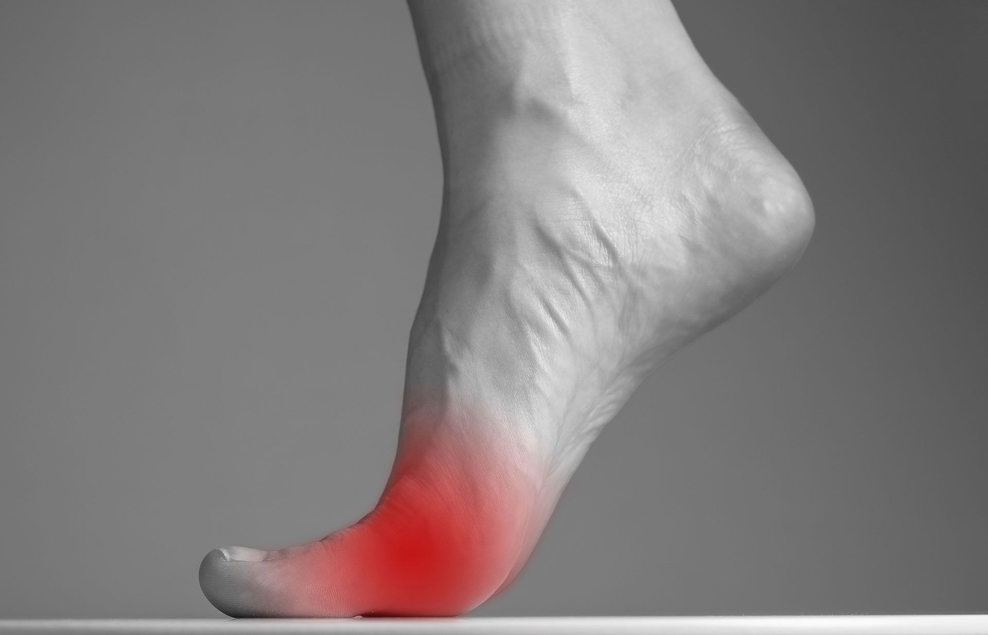Foot with red highlighted area indicating pain.