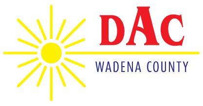 The Wadena County DAC logo features a bright yellow sun with radiating lines next to red "DAC" text and blue wording.