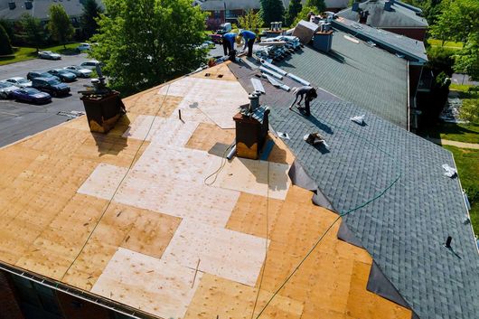Roof repairs old roof replacement with new shingles of an apartment 
