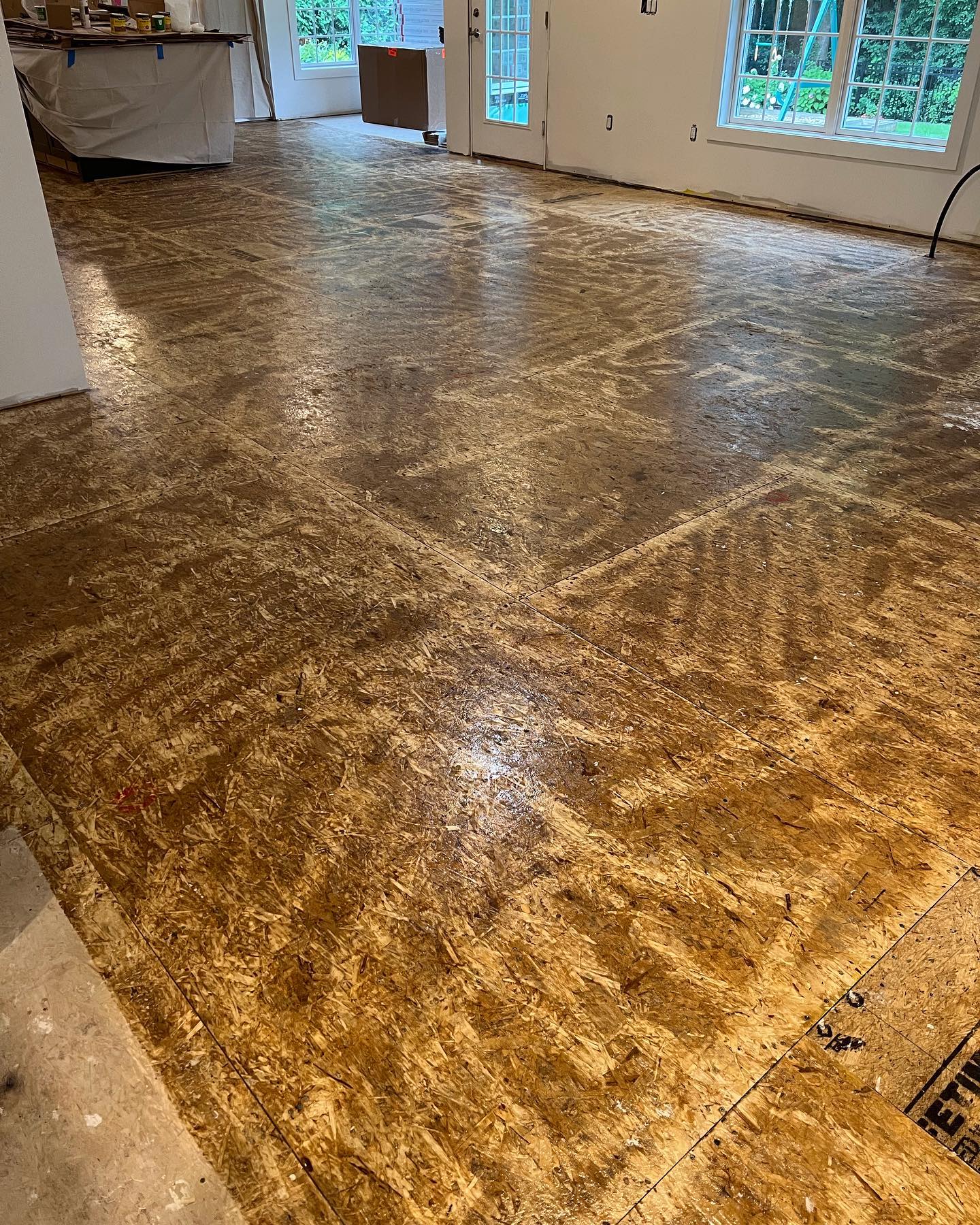 A large room with a wooden floor in it.