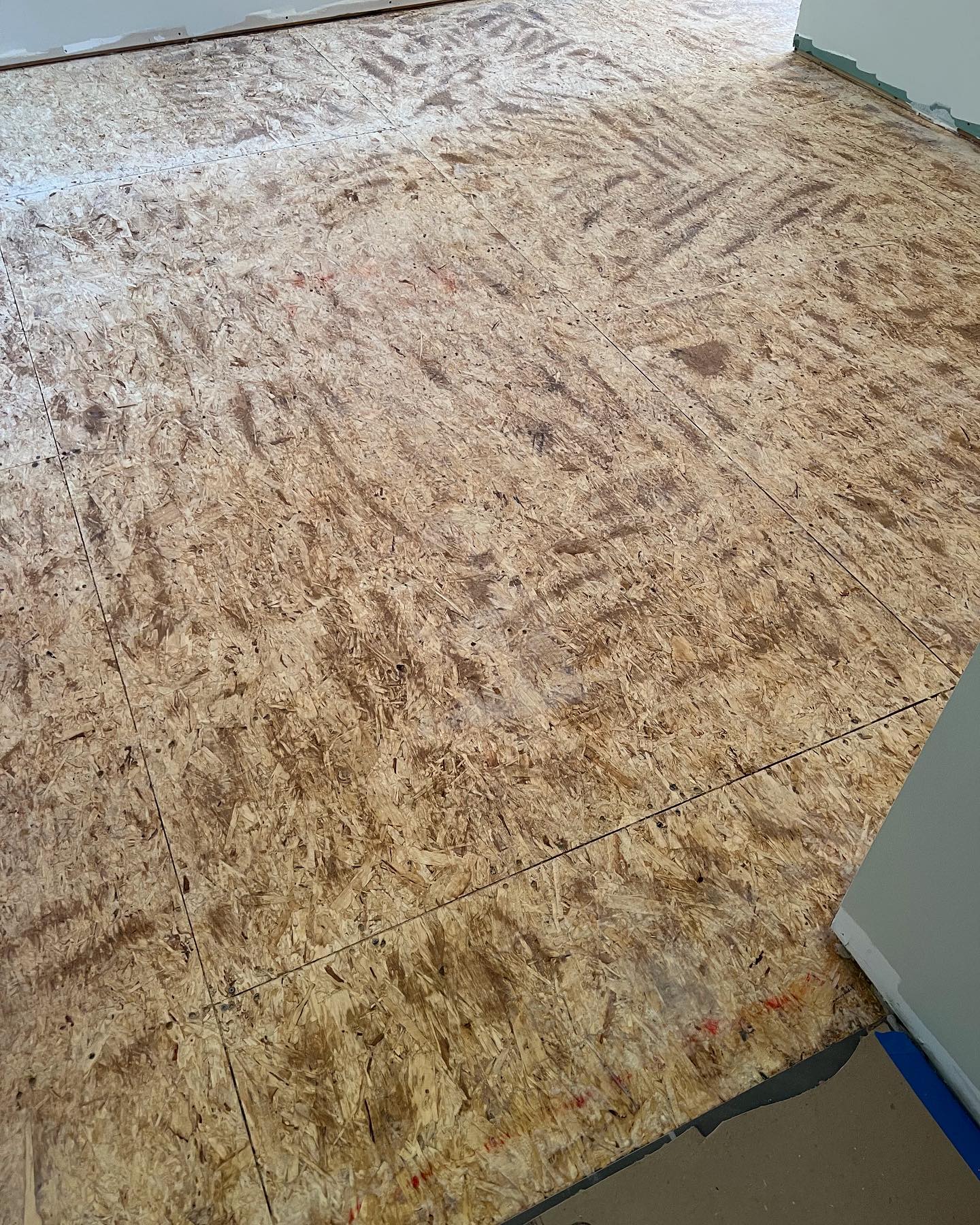 A close up of a wooden floor in a room.