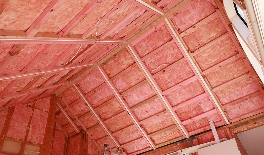 A Ceiling With Pink Insulation — Austral Insulation In Toormina, NSW