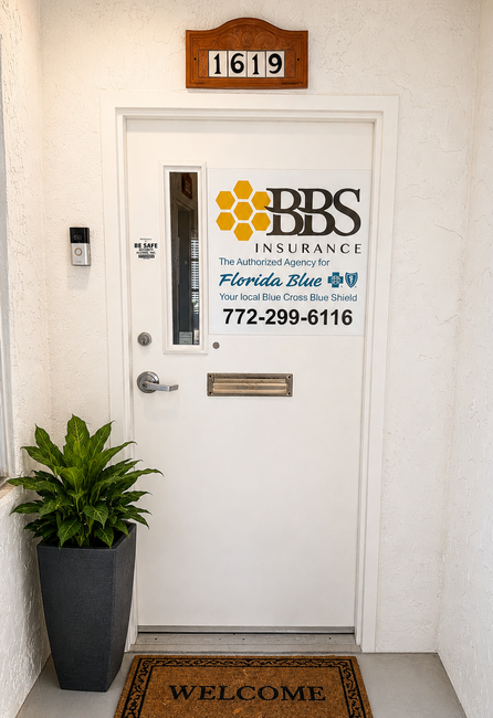 White office door with BBS sign, room 1619, welcome mat, and potted plant by the entrance