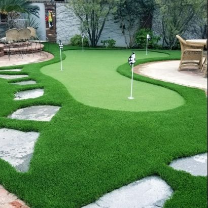 white stones and fake grass putting green