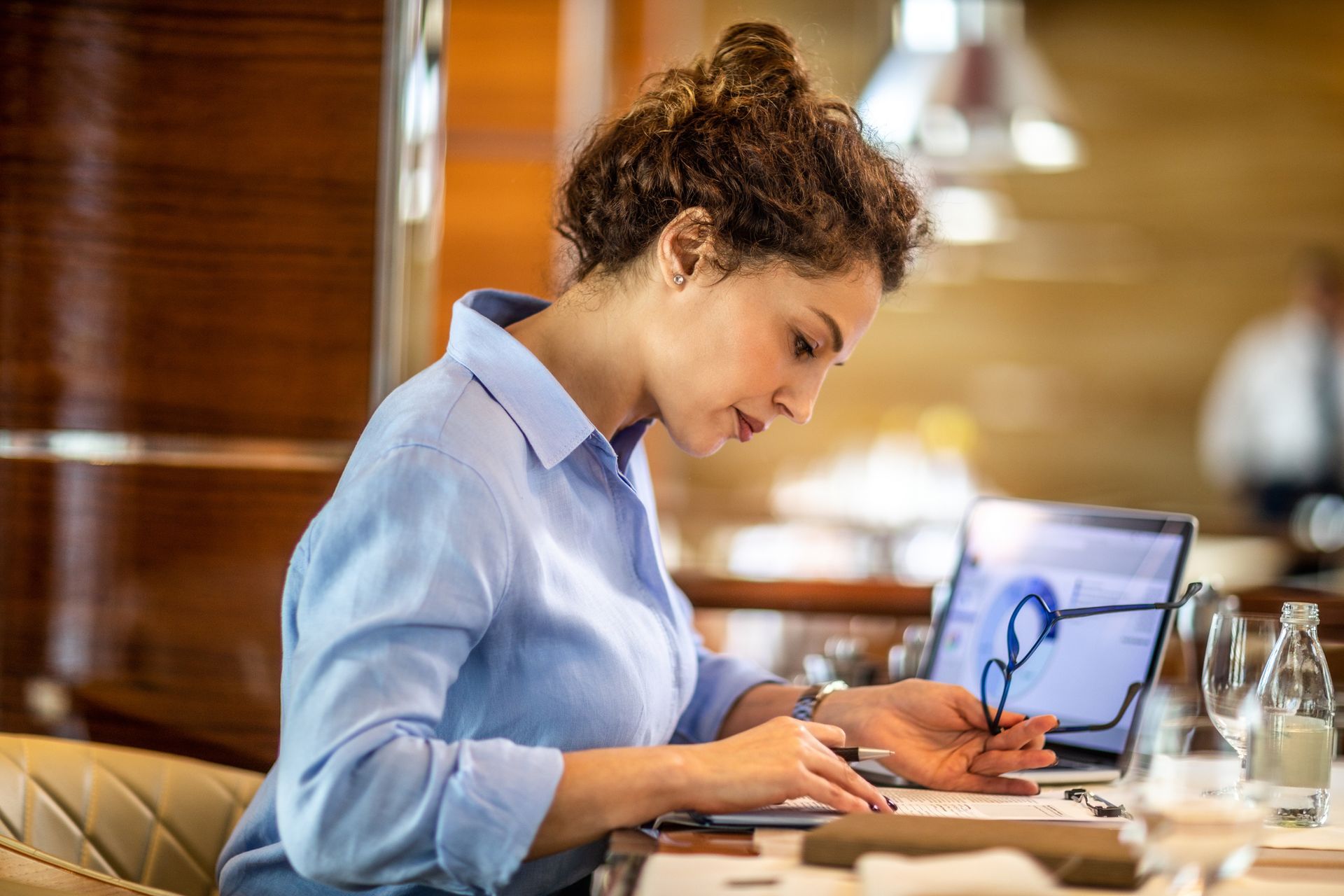 Small business owner making a financial report of her.