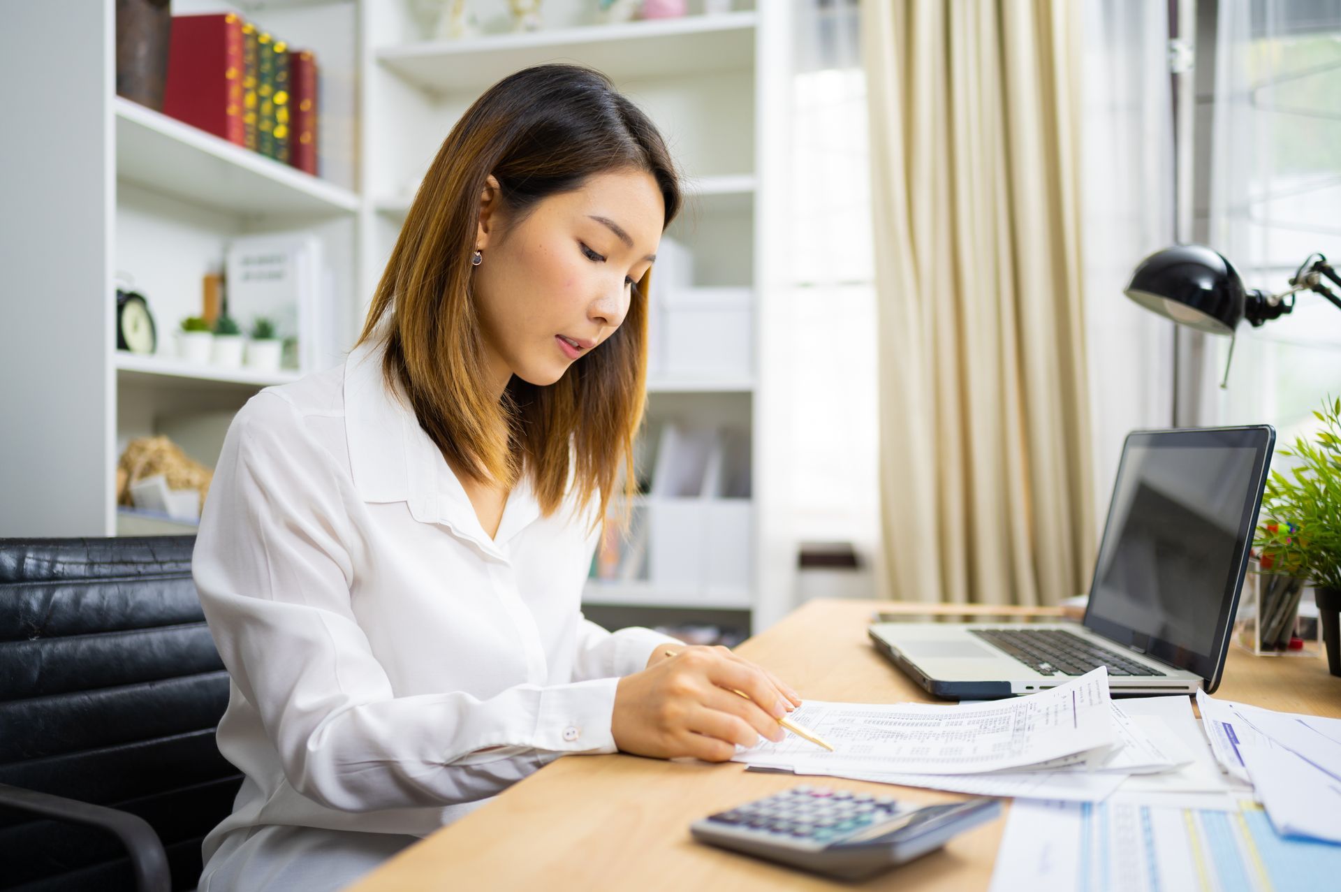 Accountant calculating tax and income working in office
