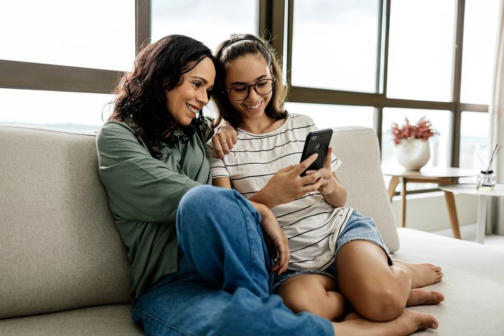 Mother and teen daughter spending time together at home.