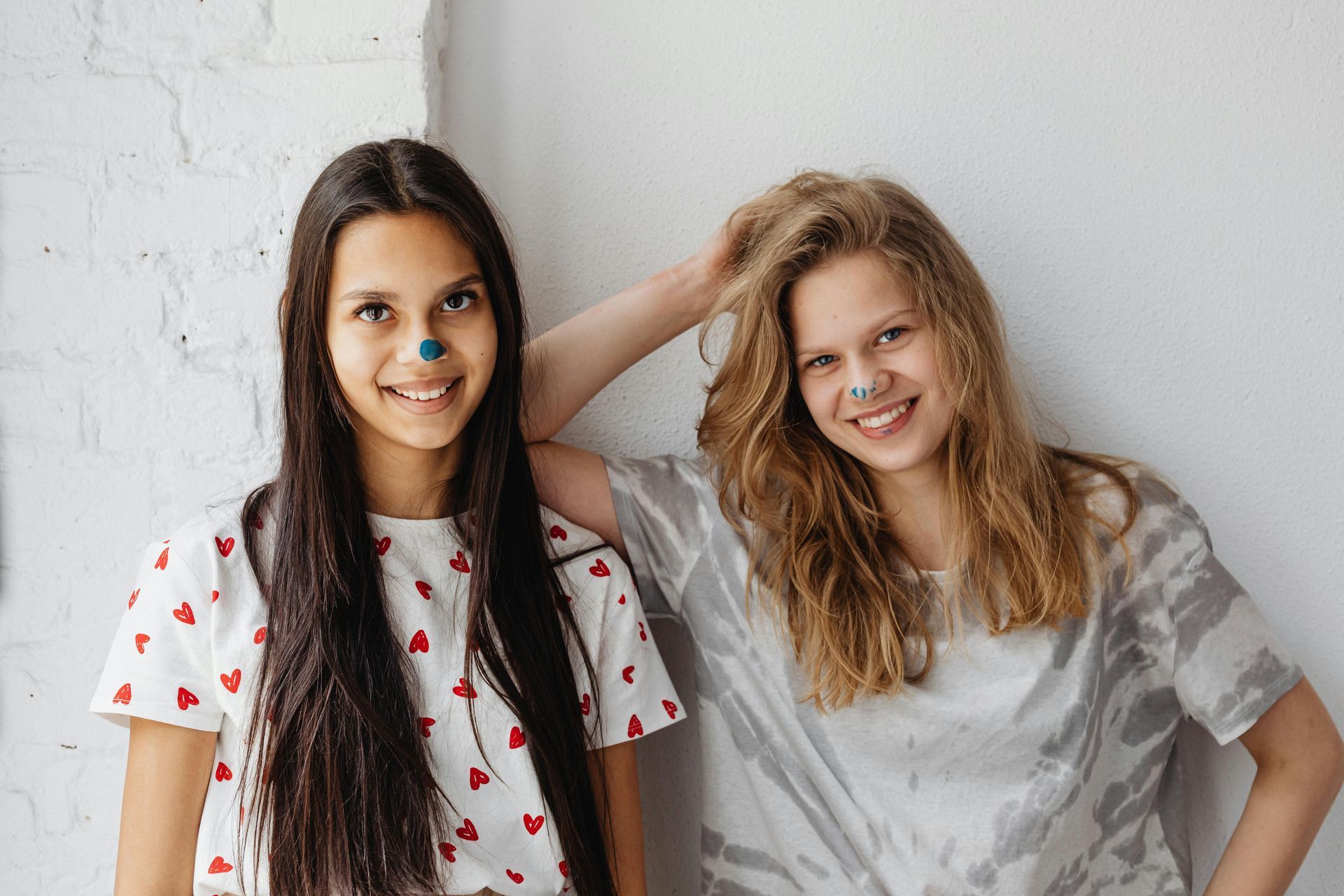 Two teenage girls smiling at camera