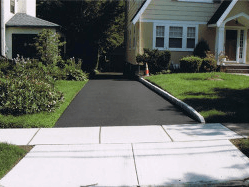 Driveway sealcoating.