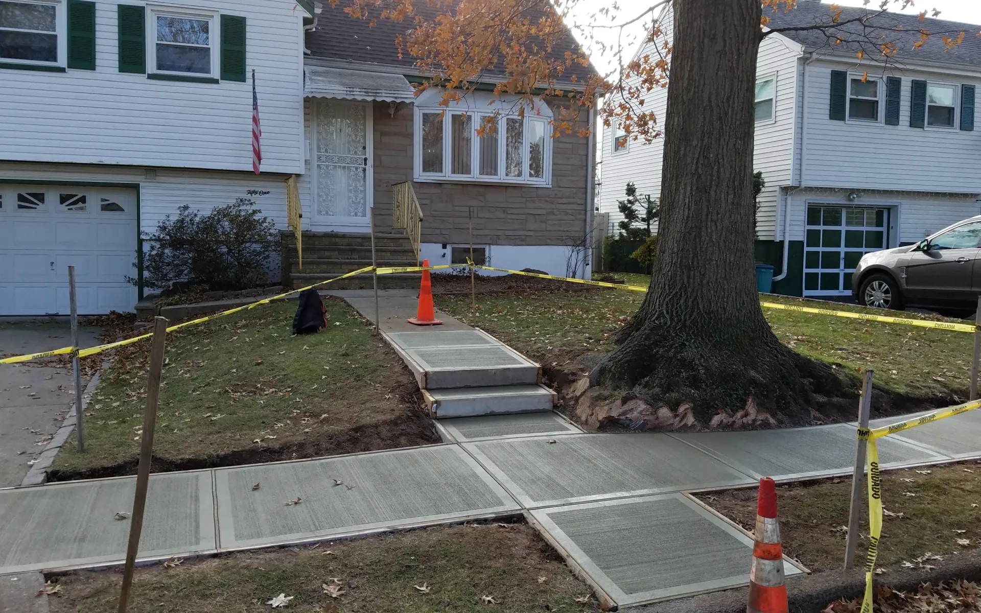 Concrete sidewalk construction around tree roots, Micciche Construction, Bloomfield, NJ.
