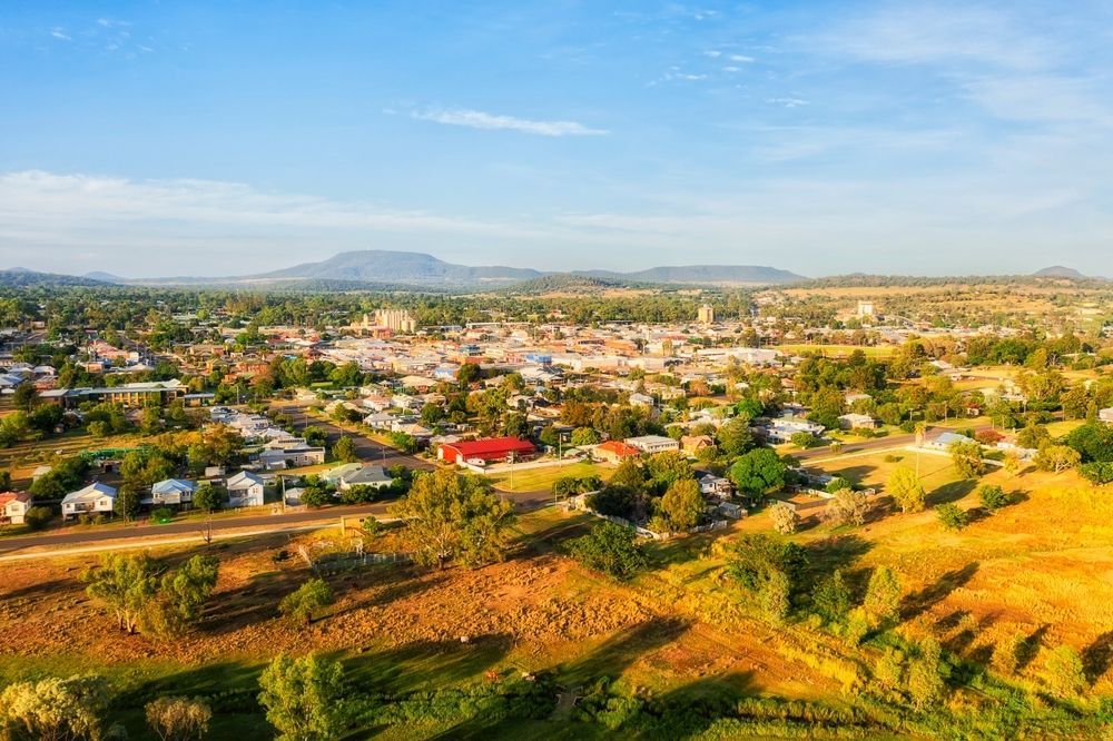 An Aerial View Of A Small Town Surrounded By Trees And Grass — PalmAir Heating & Cooling Specialists In Tumbarumba, NSW