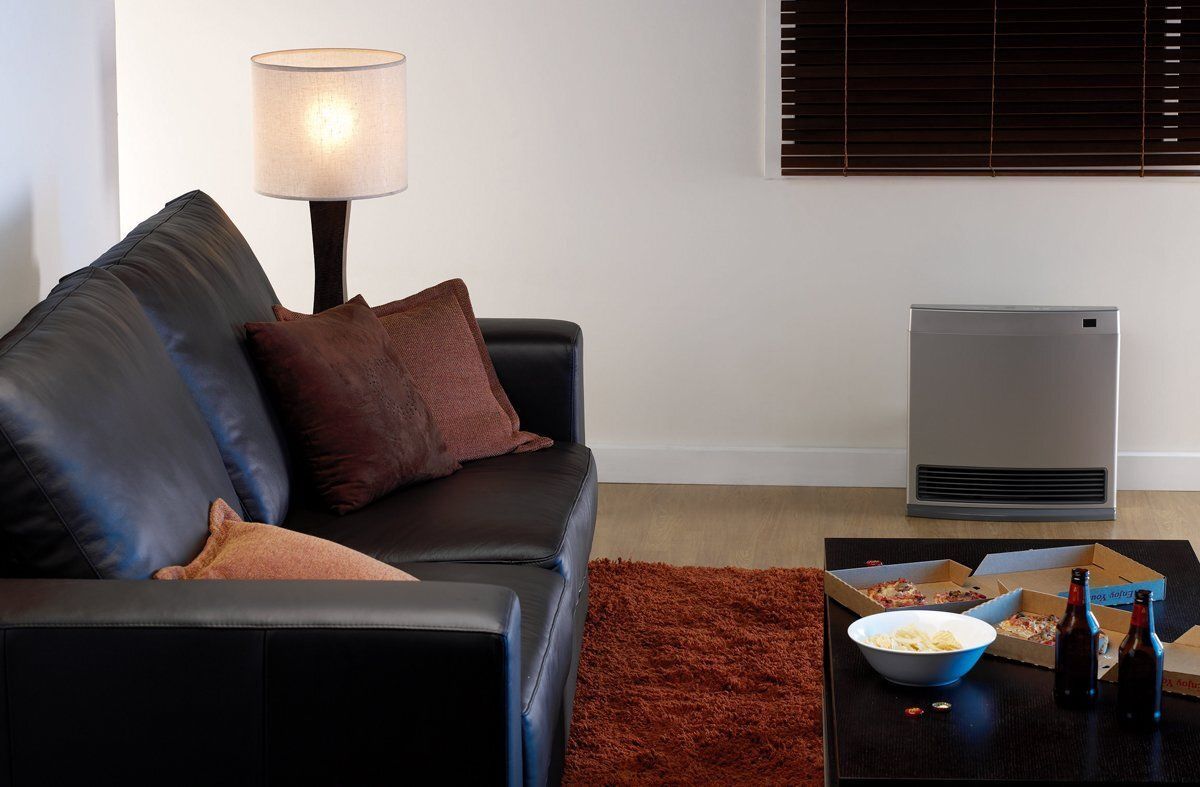 A Large Air Conditioner Is Sitting In The Backyard Of A House — PalmAir Heating & Cooling Specialists In Wagga Wagga, NSW