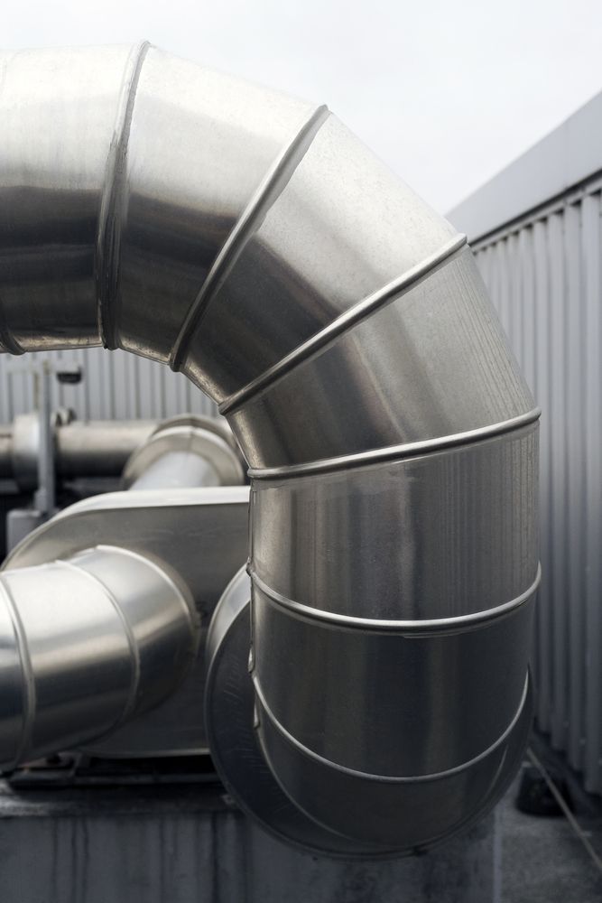 A Close Up Of A Stainless Steel Pipe On Top Of A Building — PalmAir Heating & Cooling Specialists In Temora, NSW
