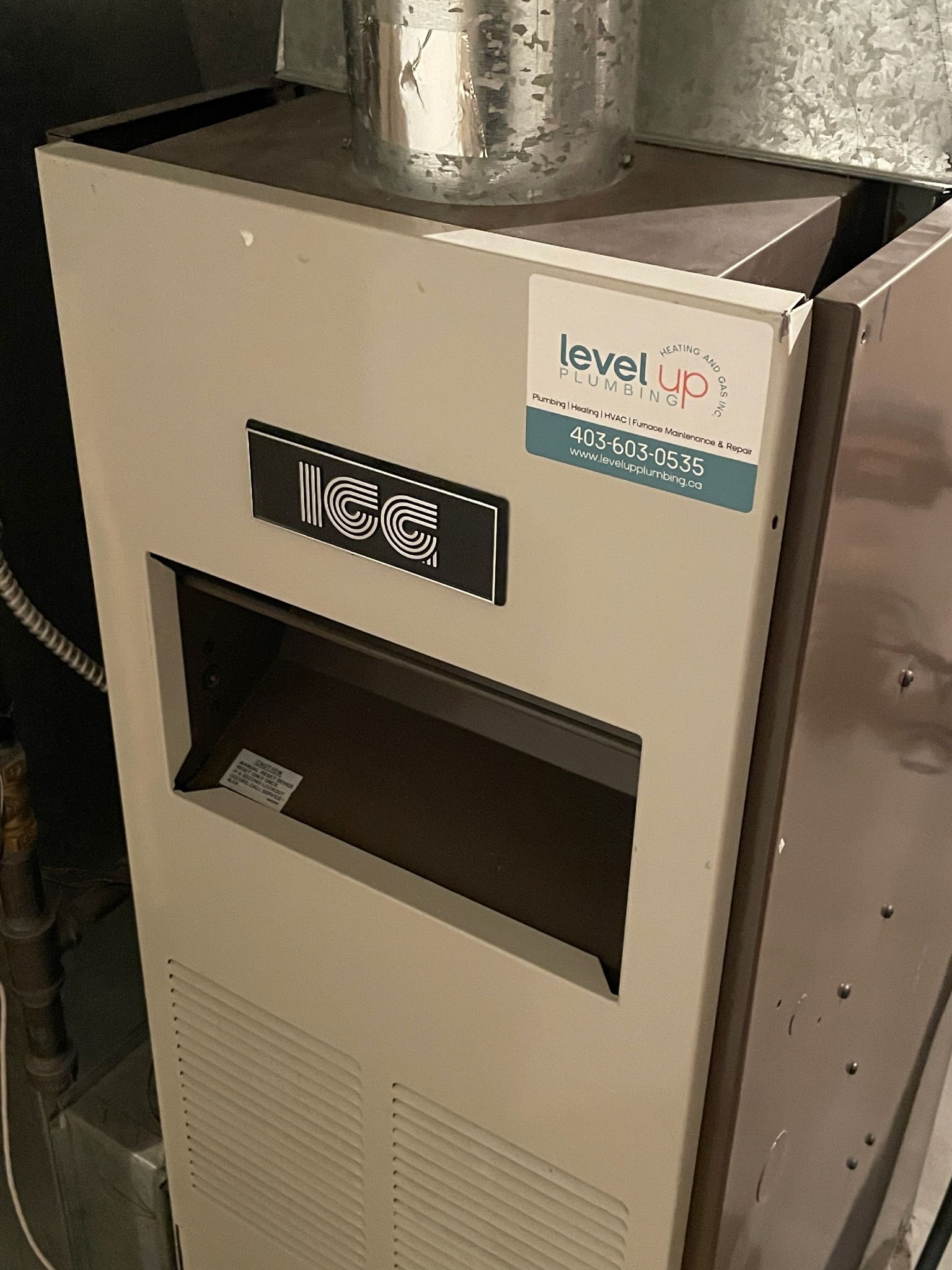 Understanding Your Heating Needs in Okotoks - a furnace with Level Up sticker