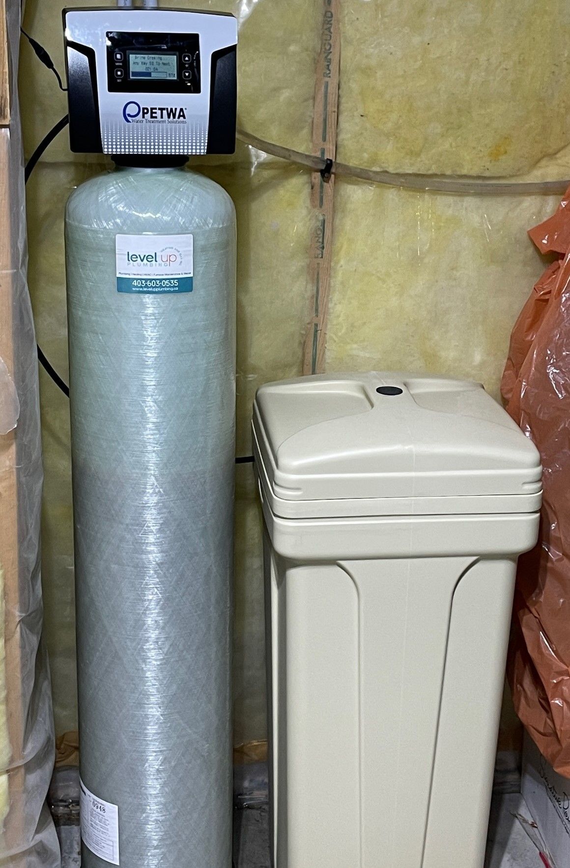 Benefits of a Water Softener System - Picture of a water softener system installed by Level Up
