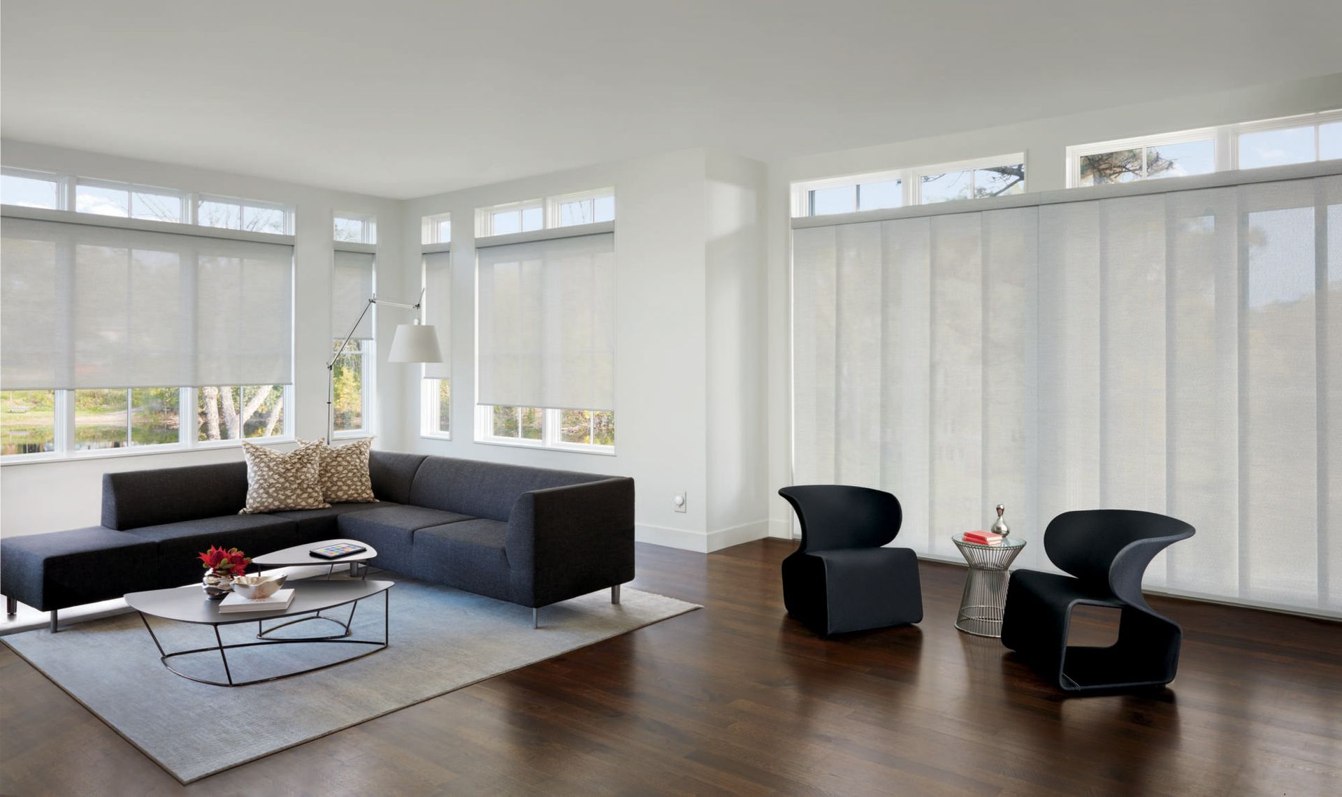 Solar shades reducing glare and blocking heat in a contemporary living room.