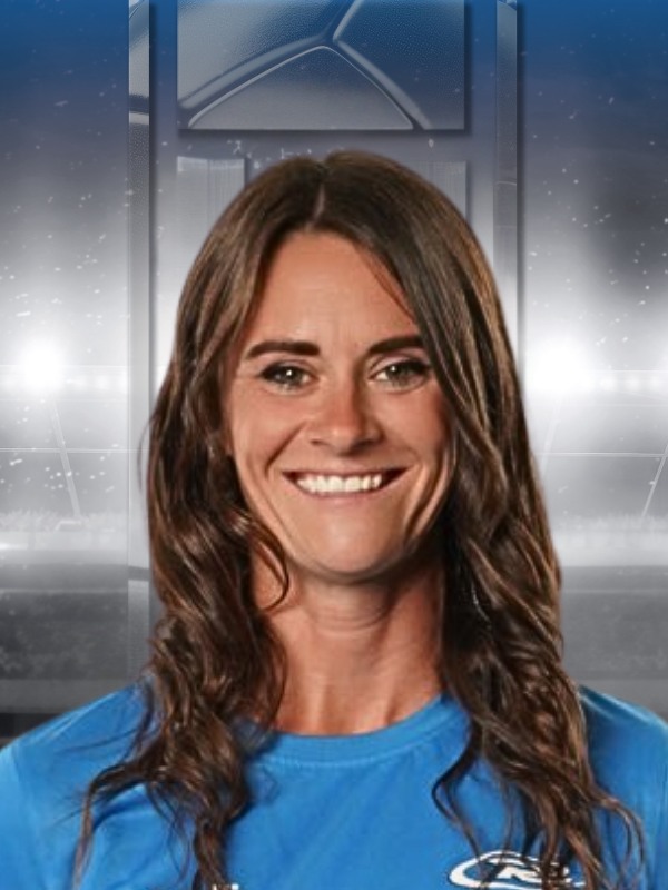 Smiling woman in a blue shirt against a blurred bridge-themed background