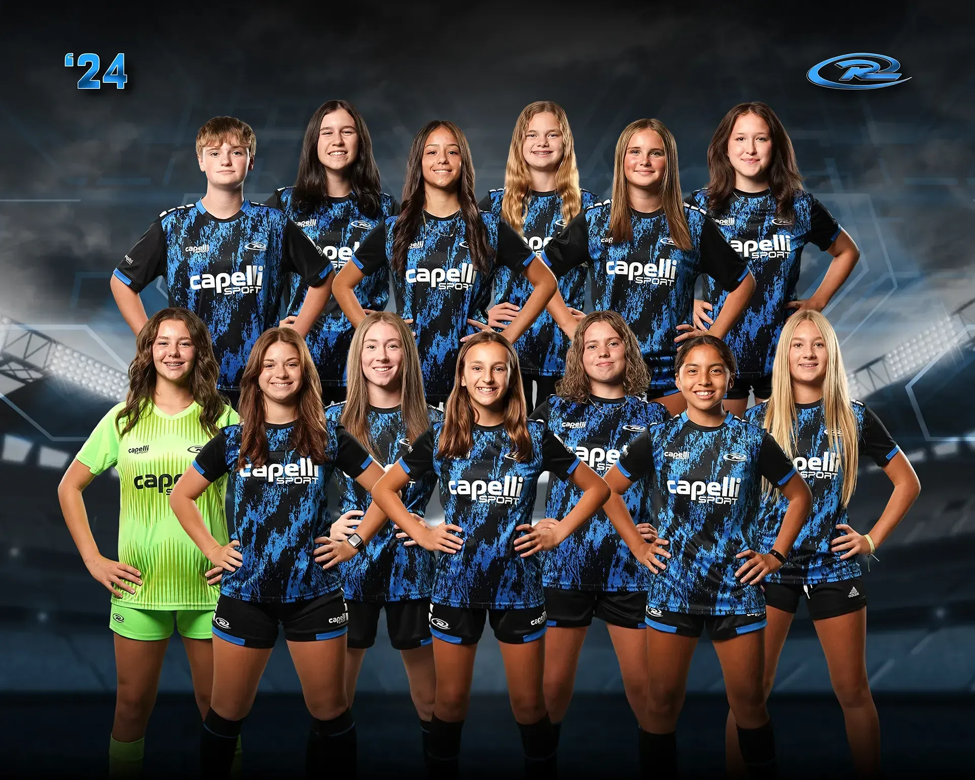 Women's sports team group portrait in blue-and-black uniforms, posing together with one player in green goalkeeper kit