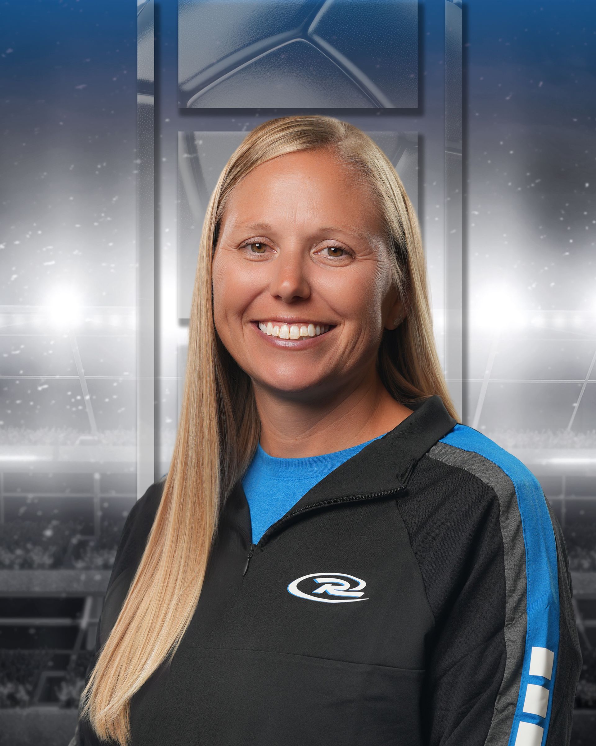 Smiling person in a black and blue athletic jacket against a stadium-style backdrop
