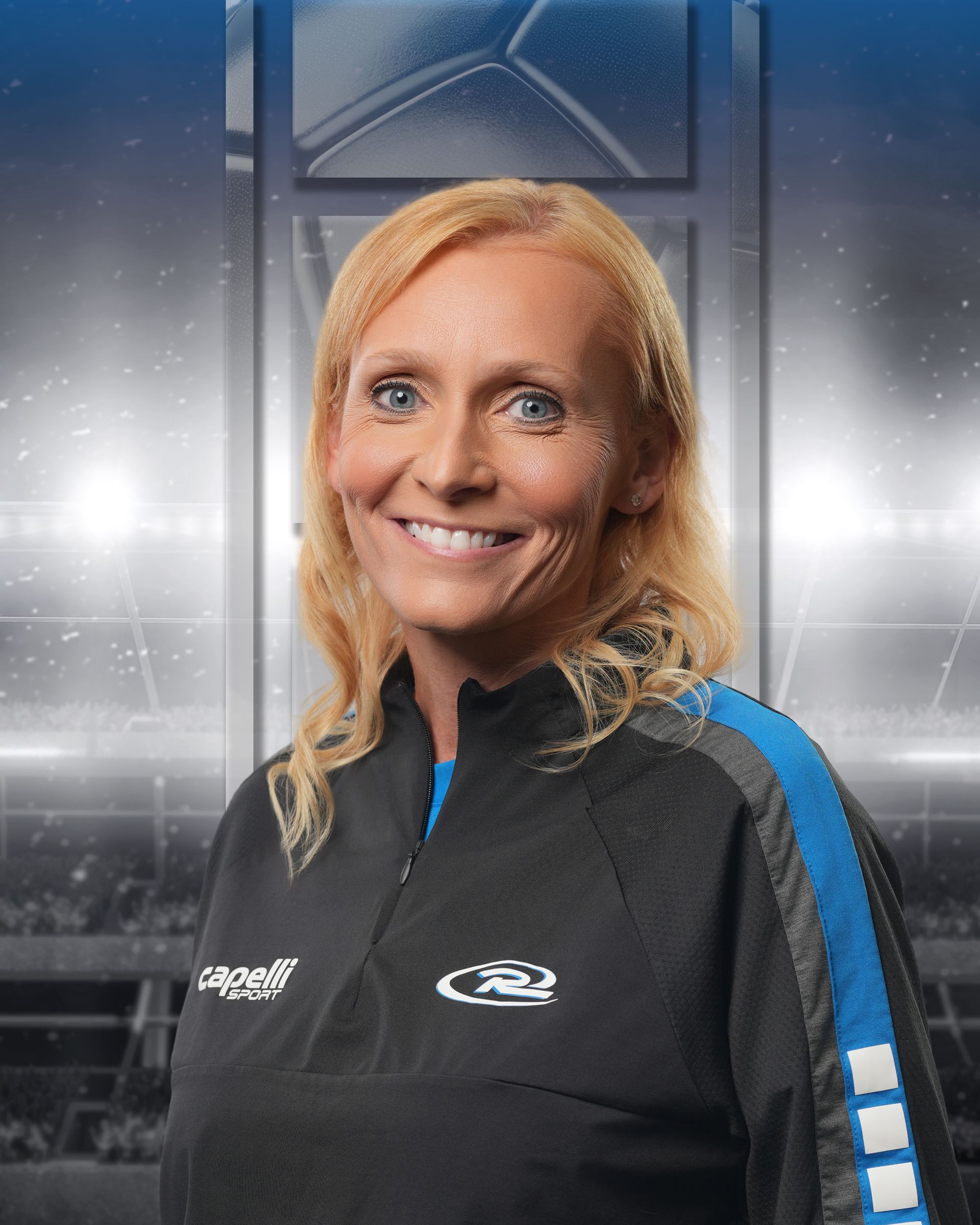 Smiling person in a black and blue sports jacket against a metallic stadium-style backdrop