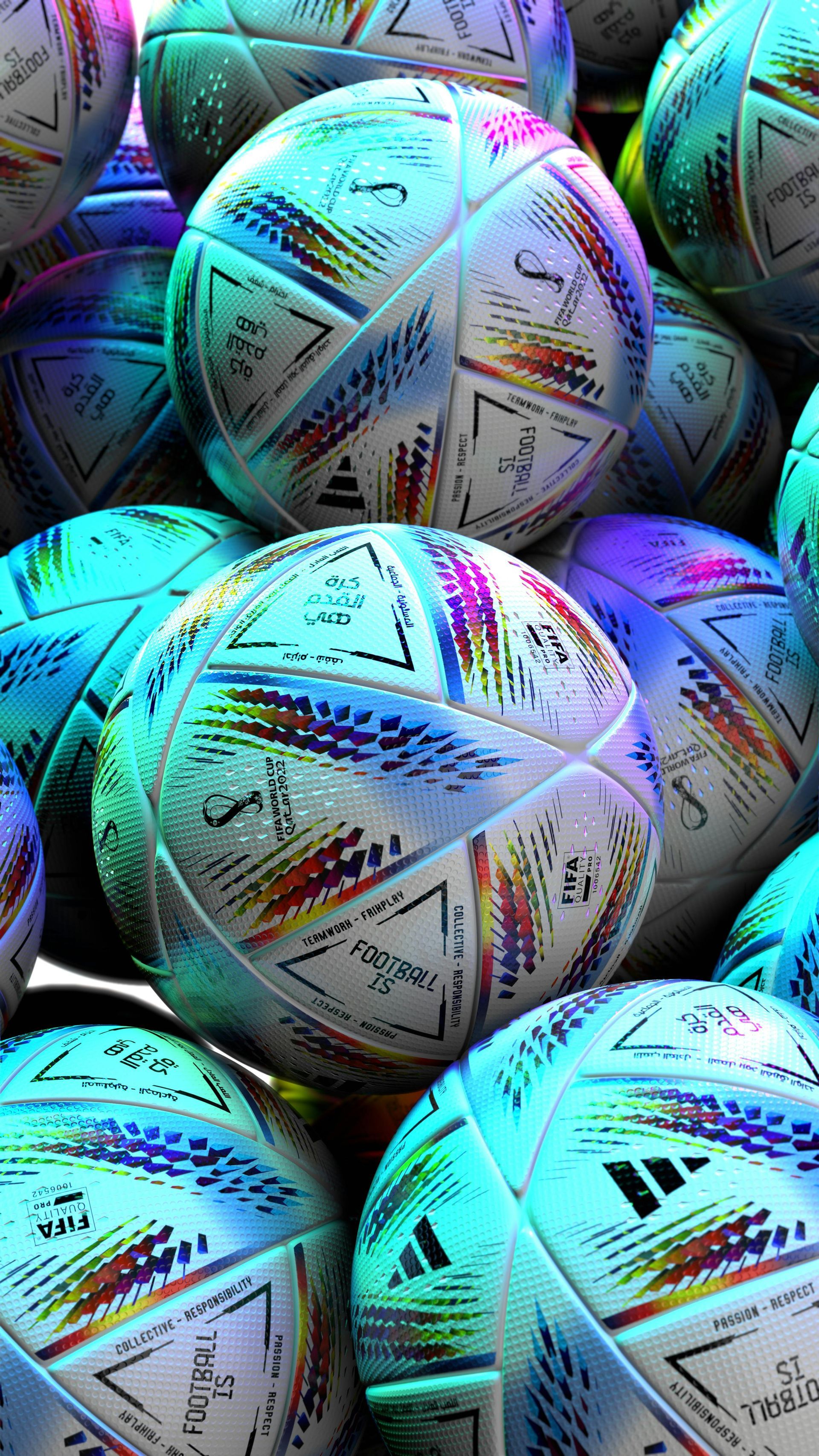 A pile of colorful patterned soccer balls in blue, purple, and white tones