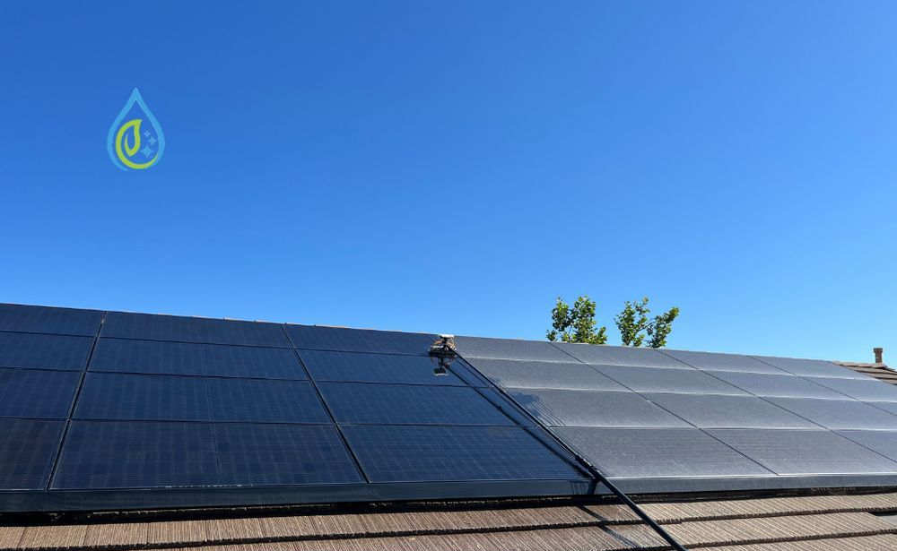Solar panels on a rooftop under blue sky, with “Solar Panel Cleaning” text overlay.
