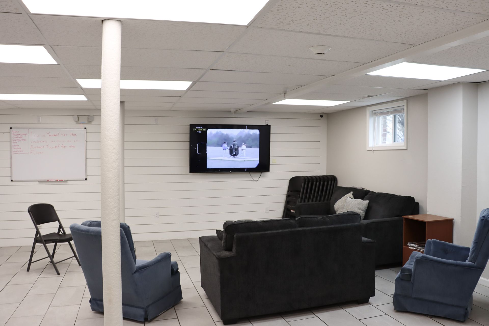 A living room filled with furniture and a flat screen tv