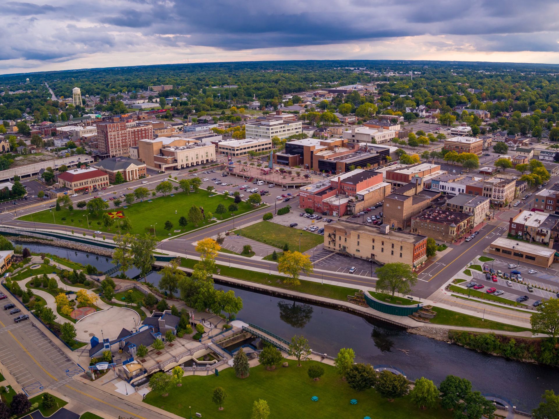 An aerial view of a small town with a river running through it.