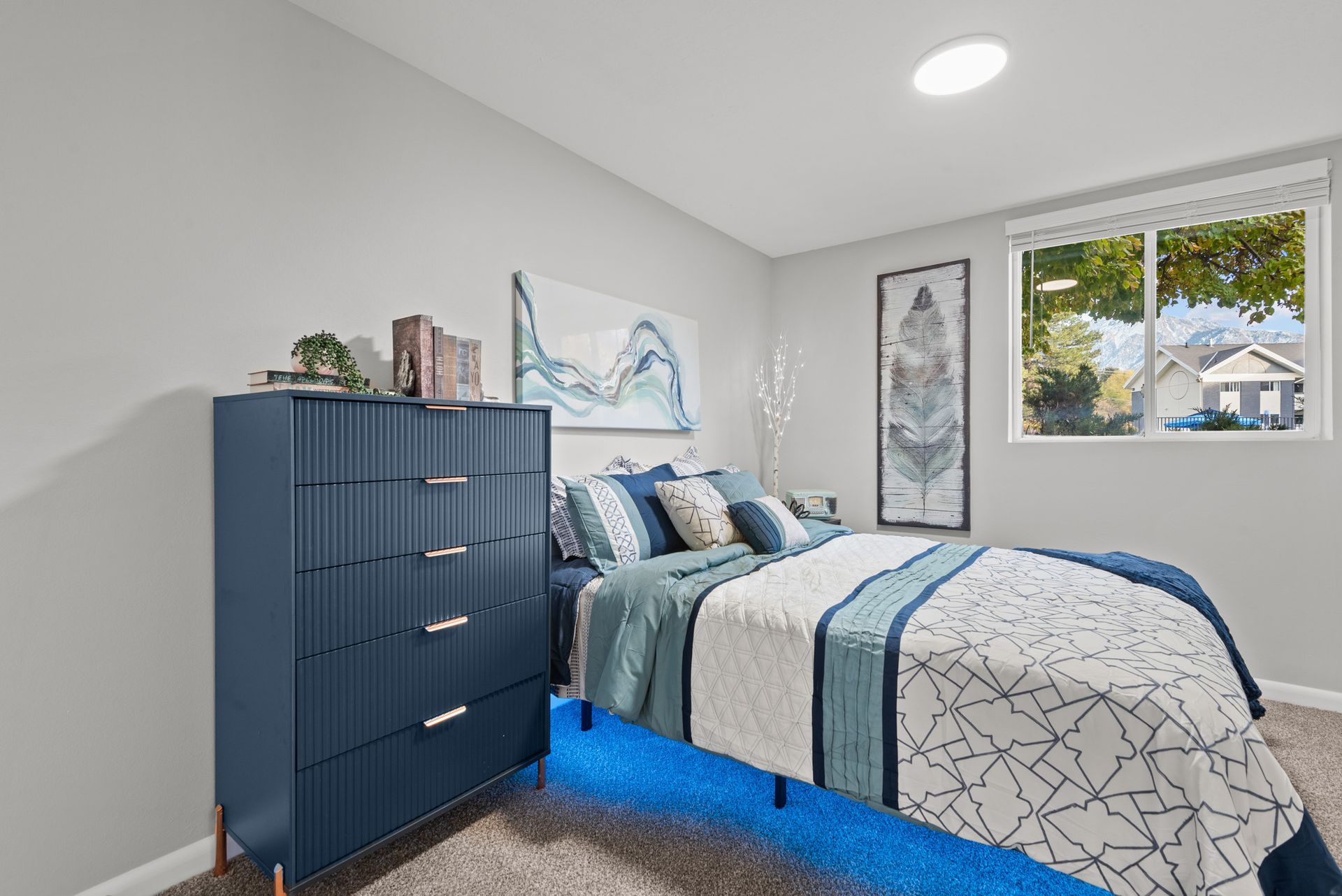 Haven on Highland Apartments Model Bedroom with Dresser and Window