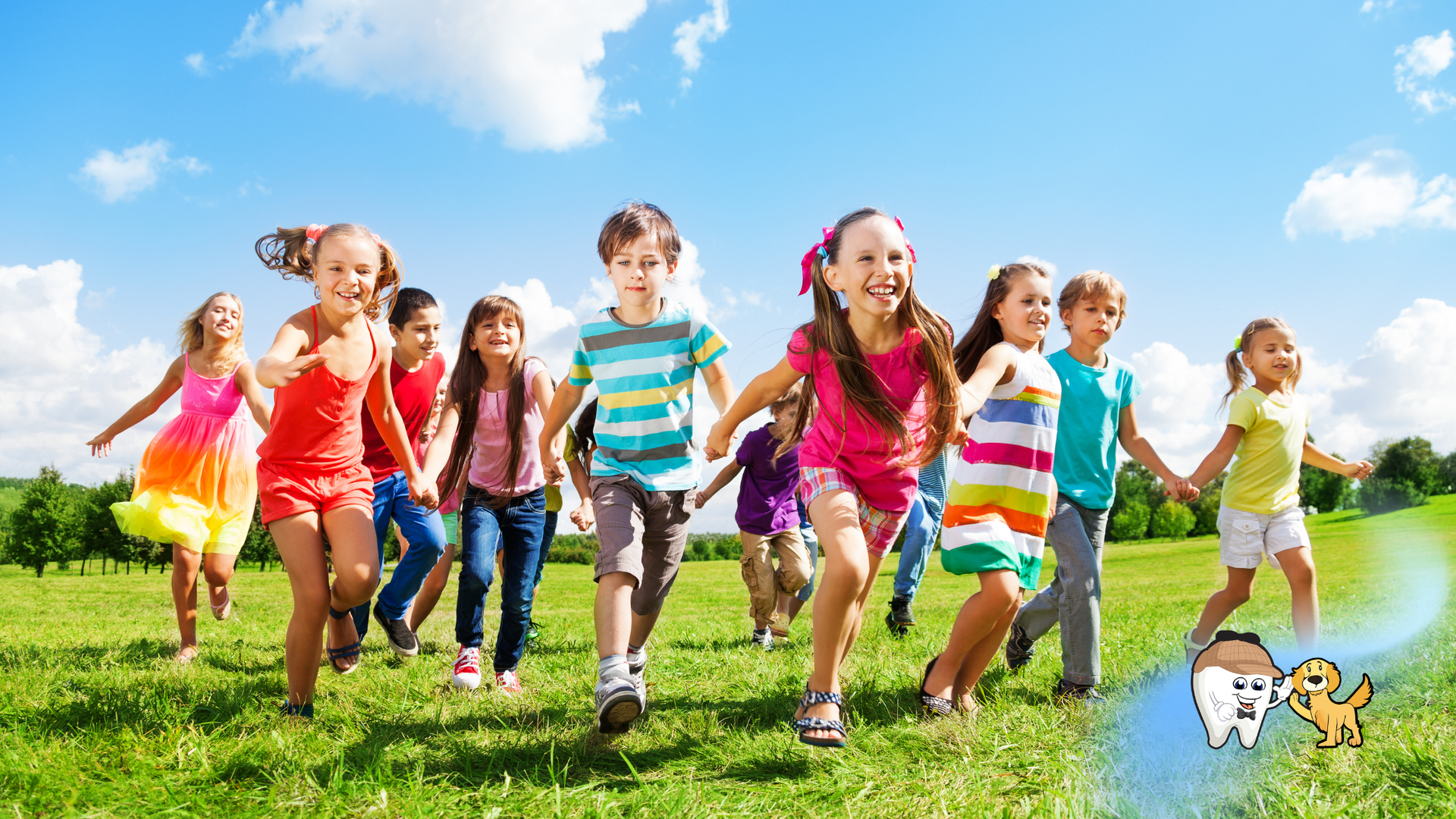 Children running and playing together on a sunny grassy field under a blue sky