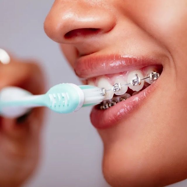 woman brushing her teeth