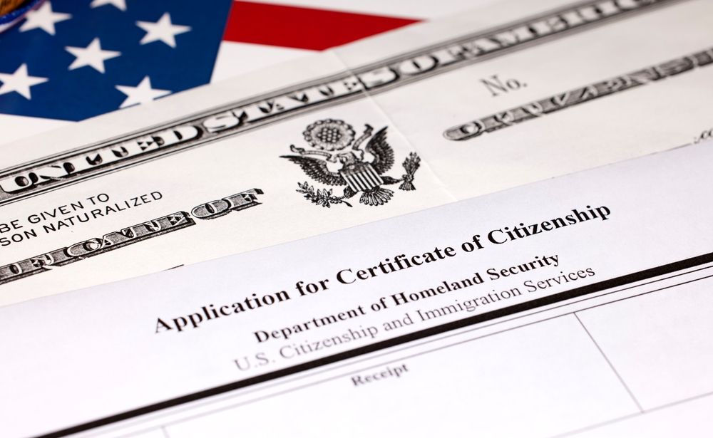 U.S. citizenship application form with an American flag in the corner