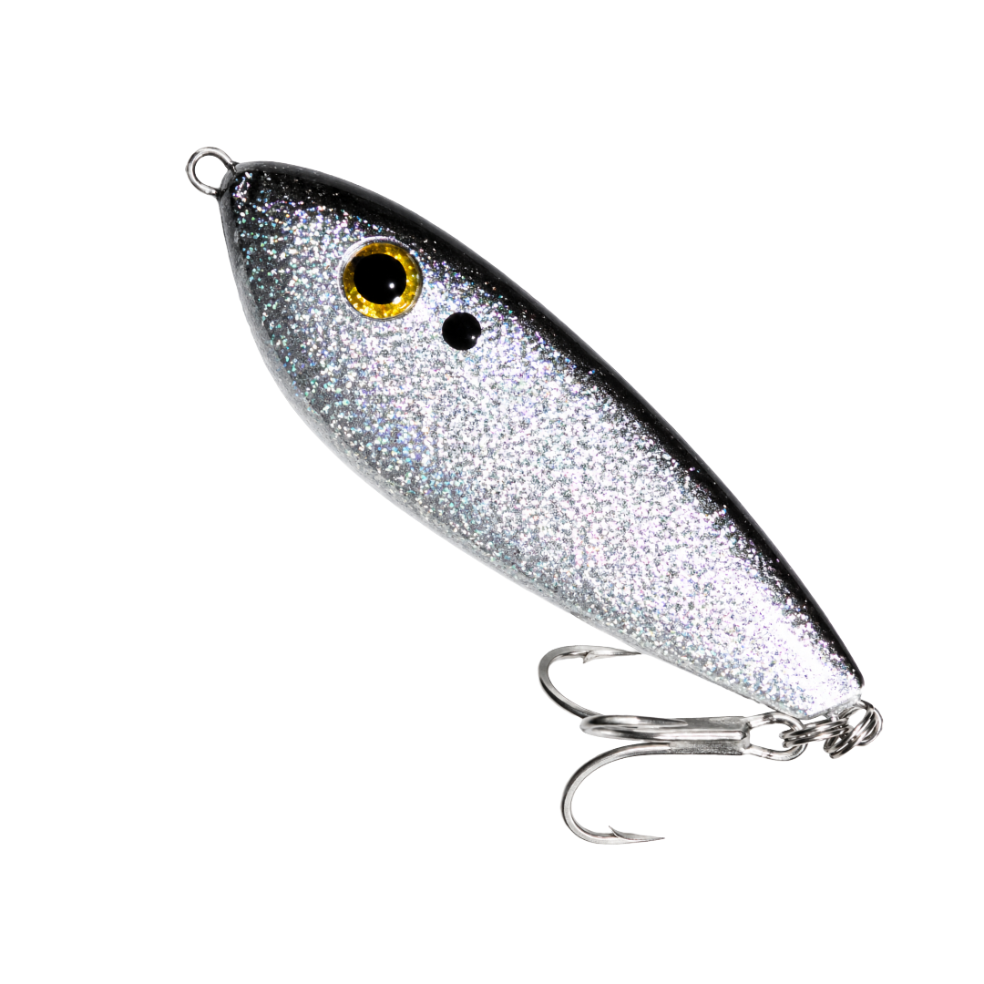 Silver fishing lure with a yellow eye and treble hook on a white background