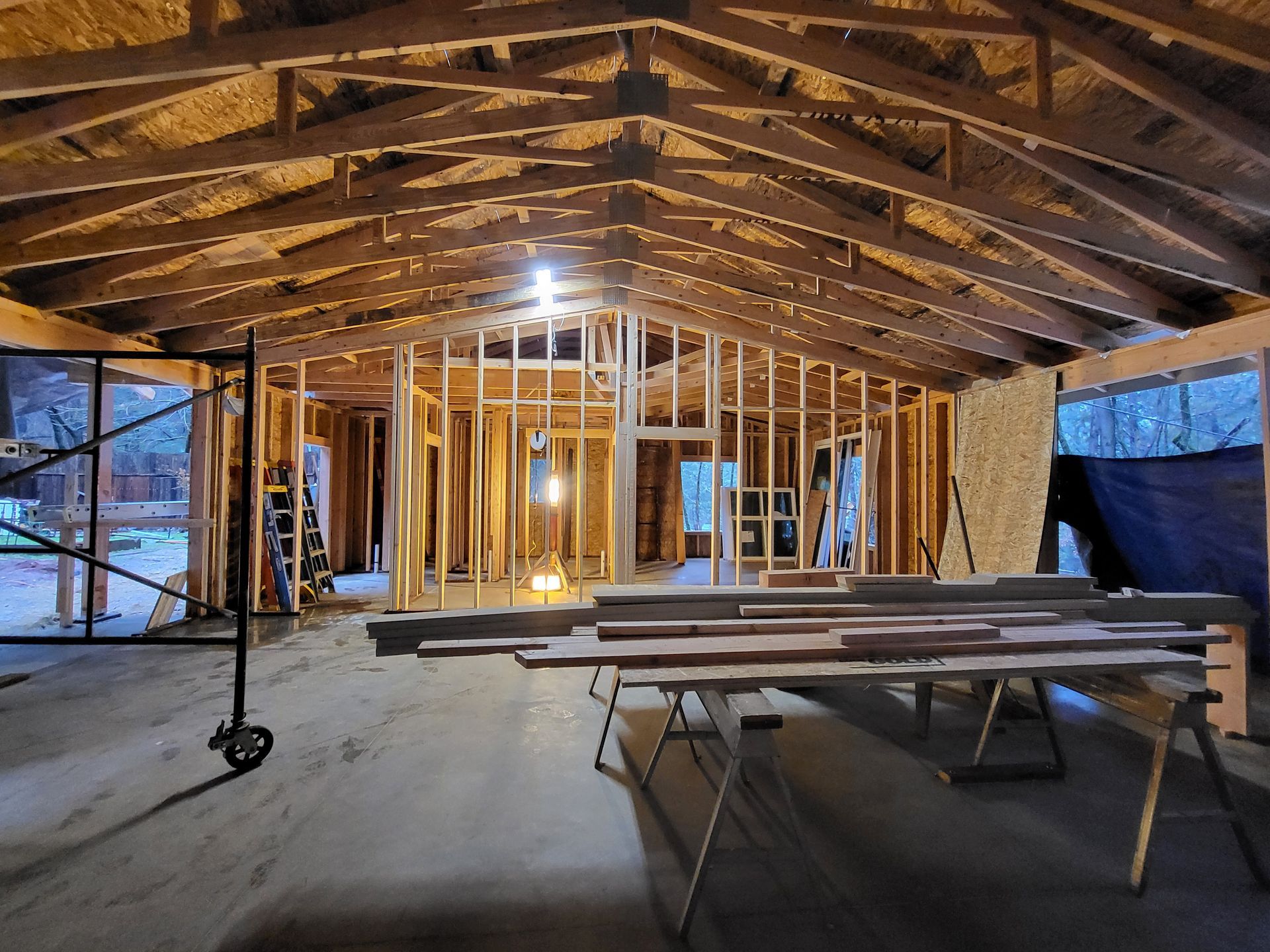 Interior of a custom home under construction showing wood framing