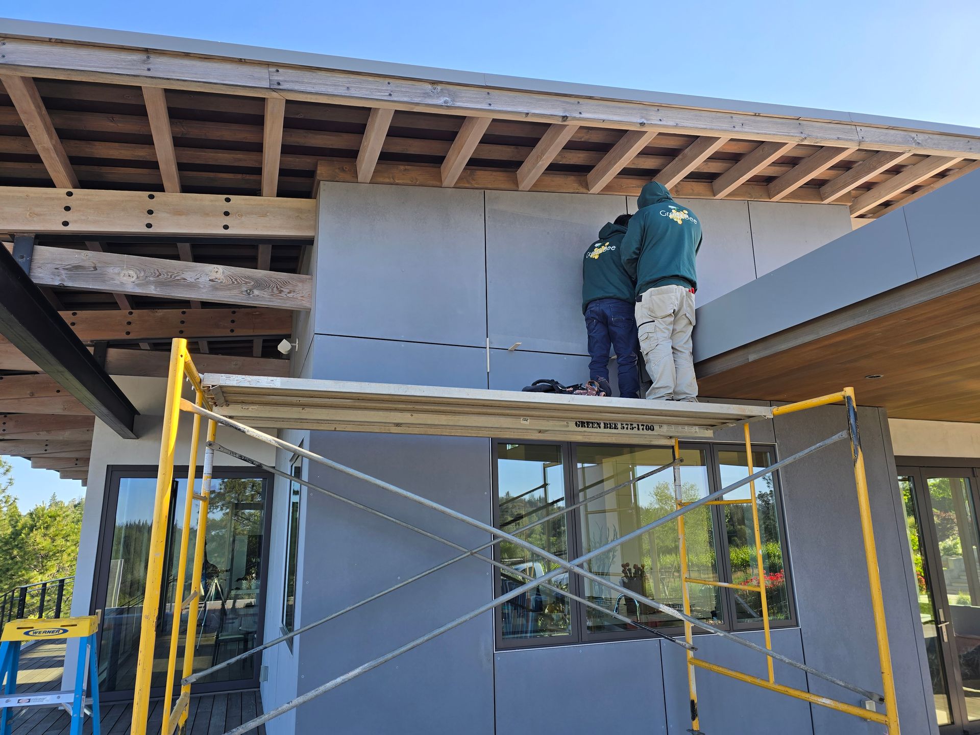 New custom home under construction in Grass Valley with exposed rafters and siding