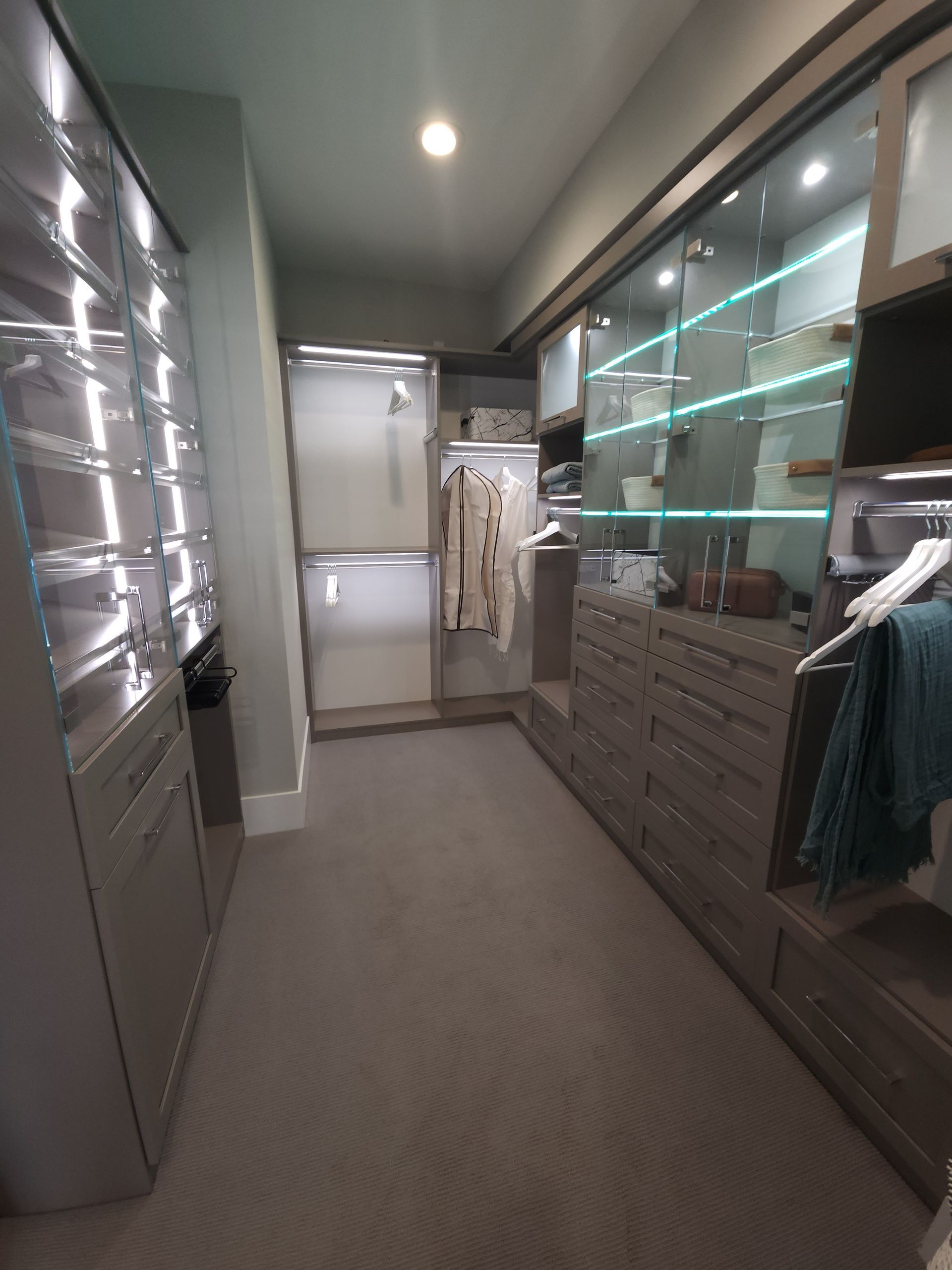 Modern bathroom with a glass-enclosed shower and custom lighting