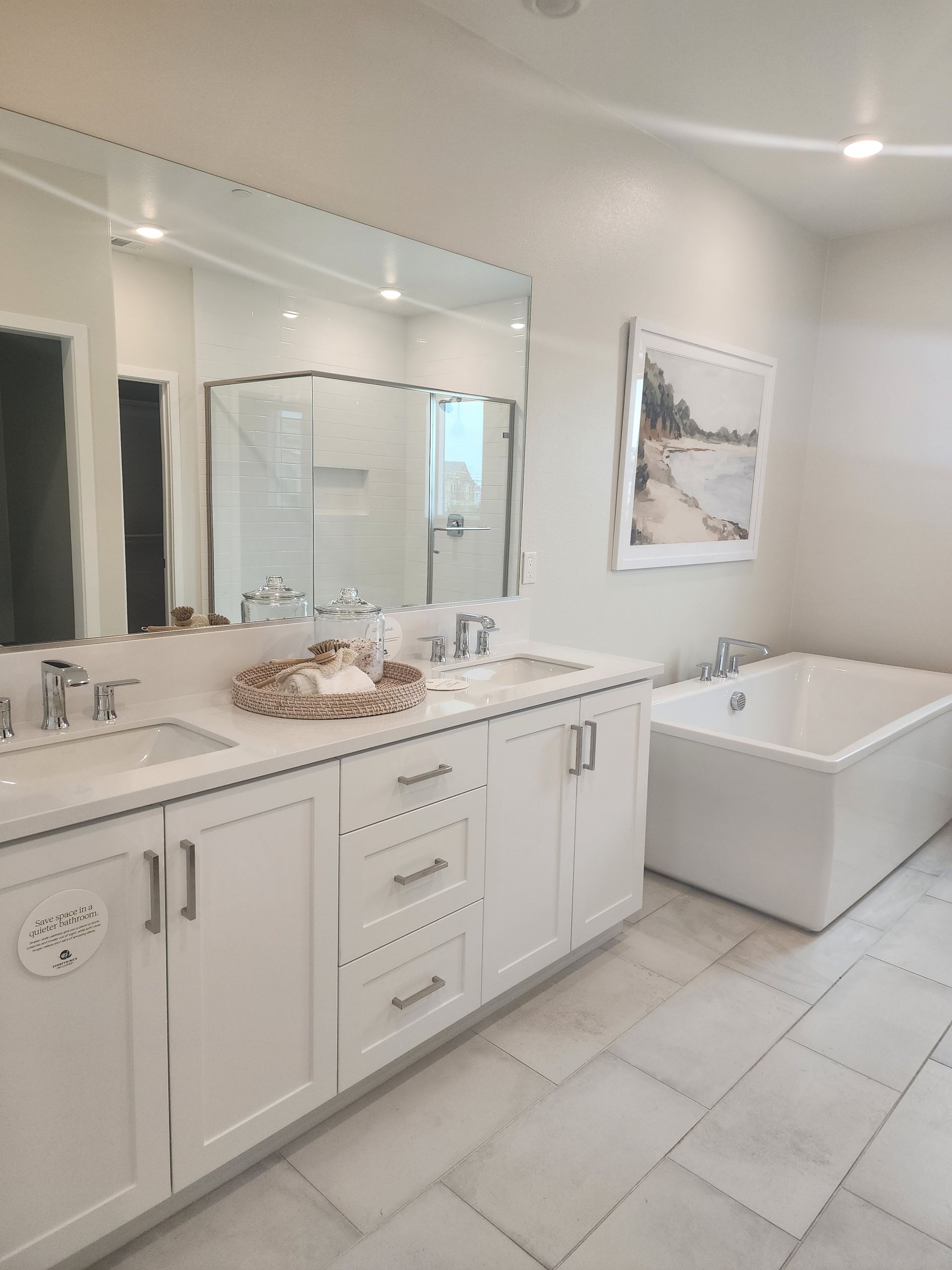 Bathroom with a vanity and a glass-enclosed shower