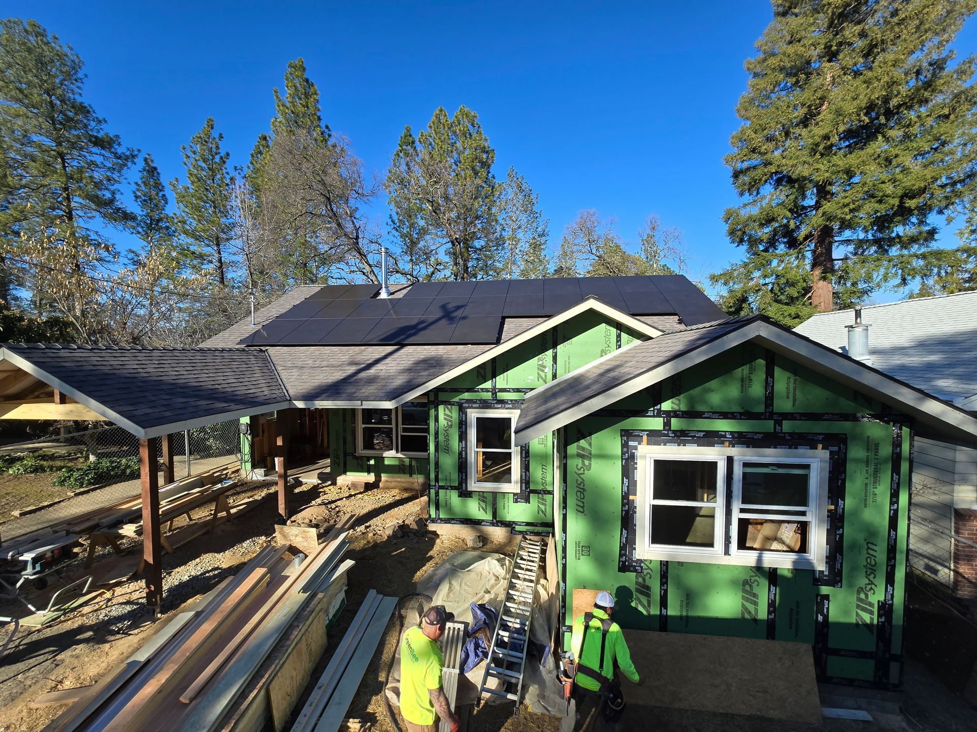 Home addition with a new roof and solar panels under construction
