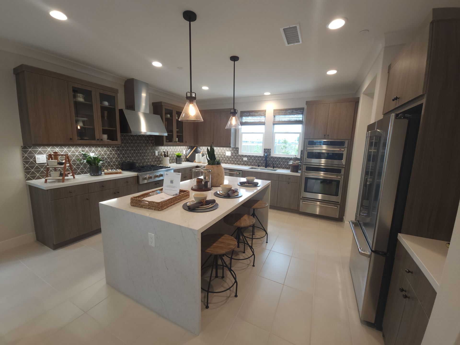 Kitchen with brown cabinets and a large center island