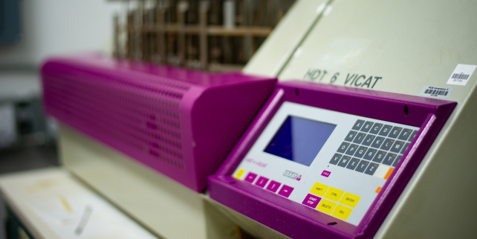 A purple and white machine is sitting on a table.