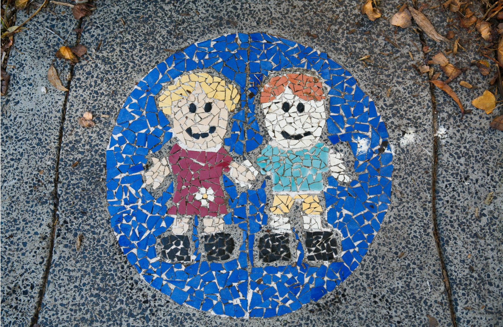A young boy is sitting on the floor reading a book. — Killarney Vale Preschool In Tumbi Umbi, NSW