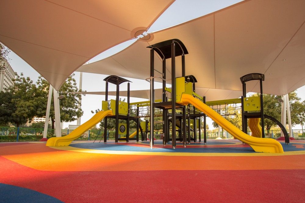A Colourful Playground With a Slide and Stairs Under a Canopy — Killarney Vale Preschool In Tumbi Umbi, NSW