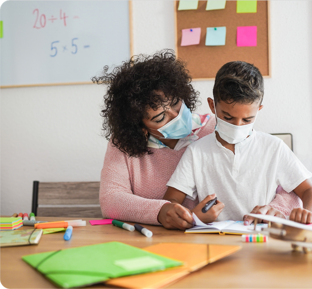 Teacher wearing a mask, helping student with mask