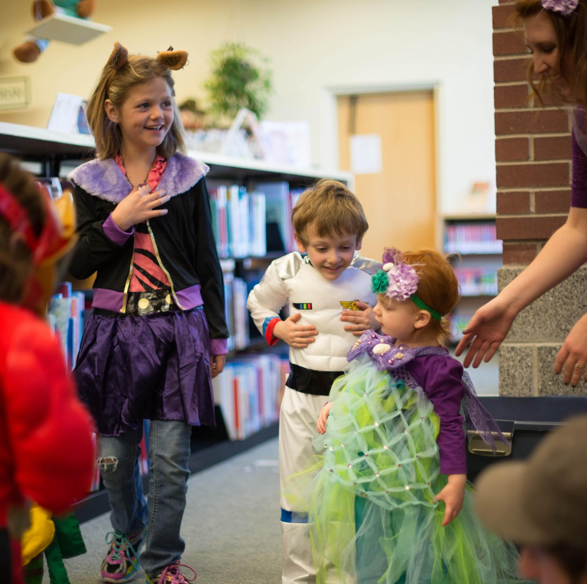 Young kids playing with costumes
