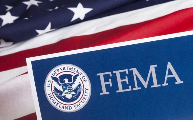 A blue sign with the FEMA logo and the text 