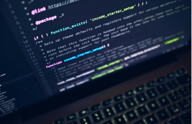 A close up of a computer screen with a keyboard in the foreground