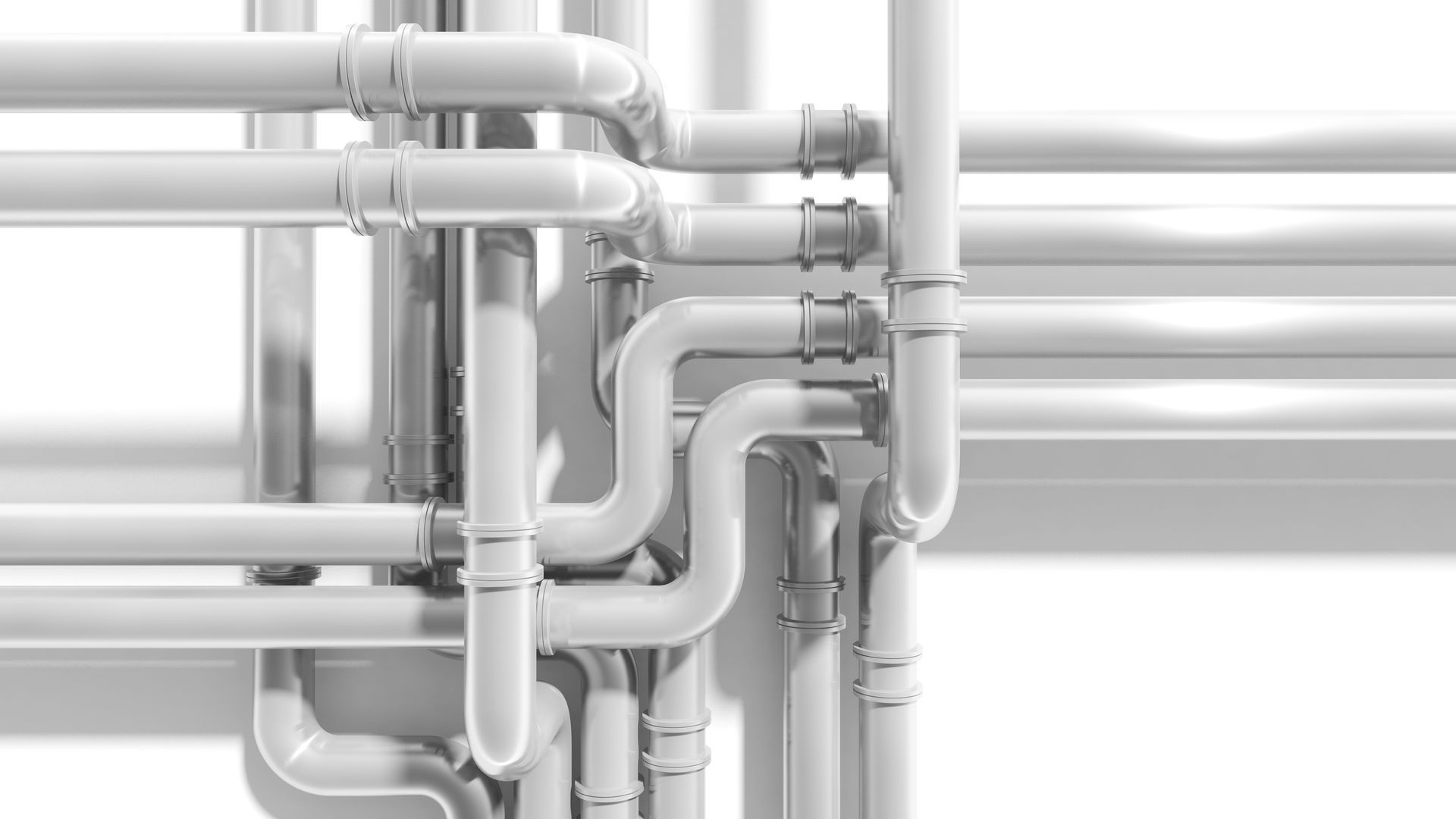 White industrial pipes and joints running horizontally and vertically against a light gray background.