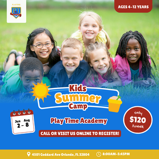 A group of children are laying in the grass for a kids summer camp