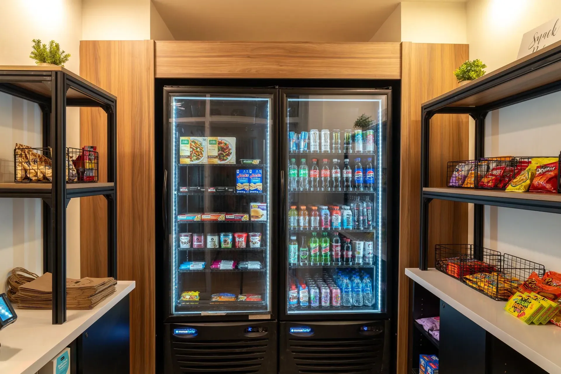 Snack and drink vending machines with various items.